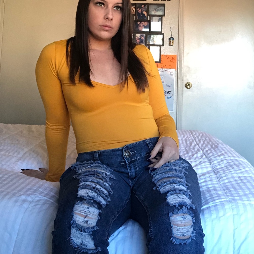 Ripped blue denim jeans